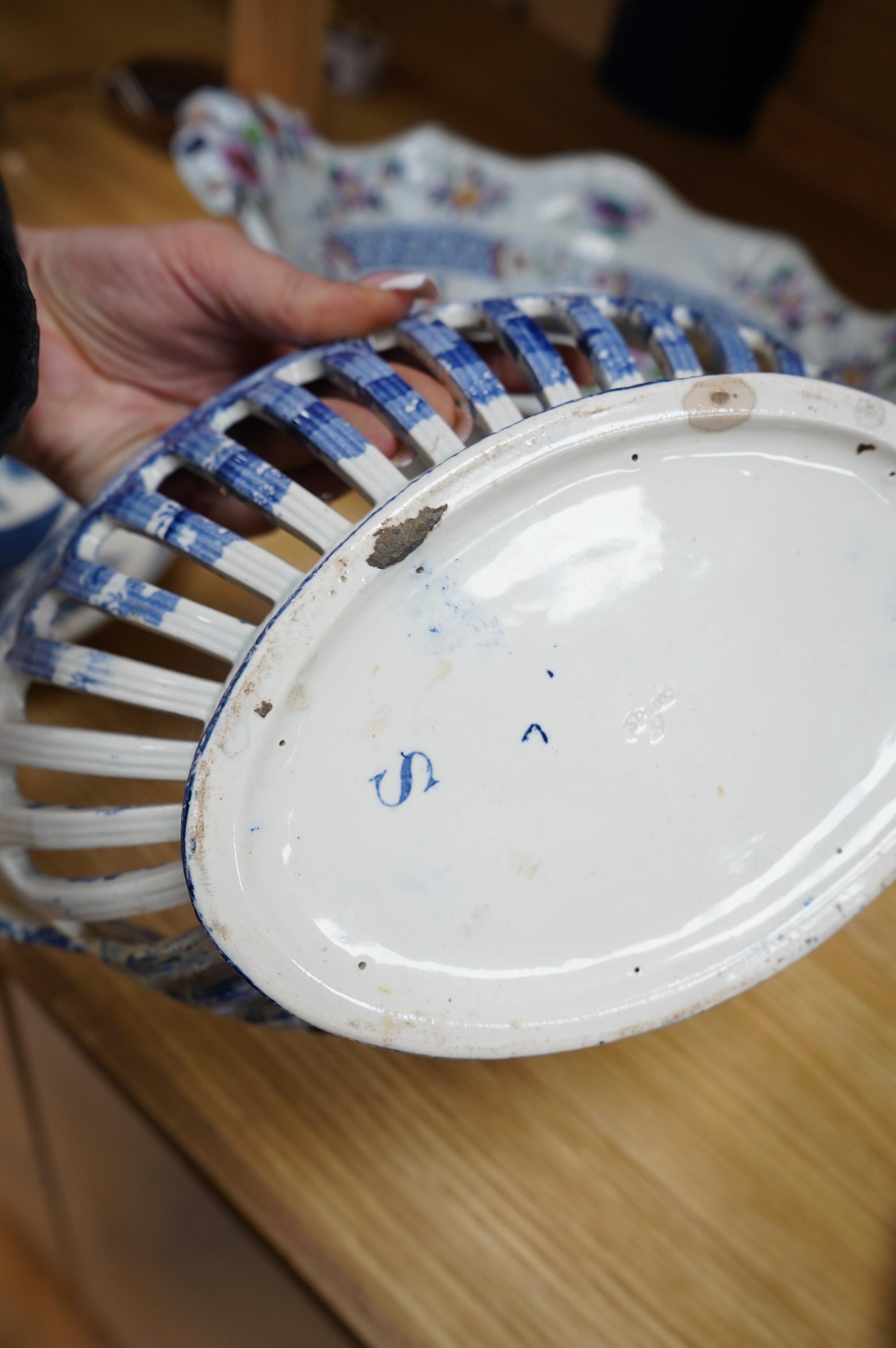 A Spode blue and white oval basket, a Spode two-handled pedestal dish, a Caughley Fisherman pattern saucer dish and two other items, largest 38cm wide. Condition - varies